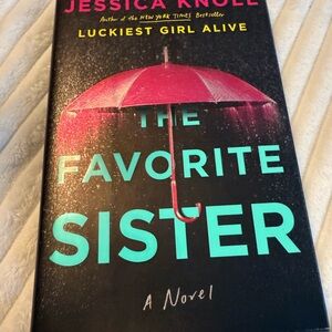 The Favorite Sister Novel with Pink Umbrella Cover